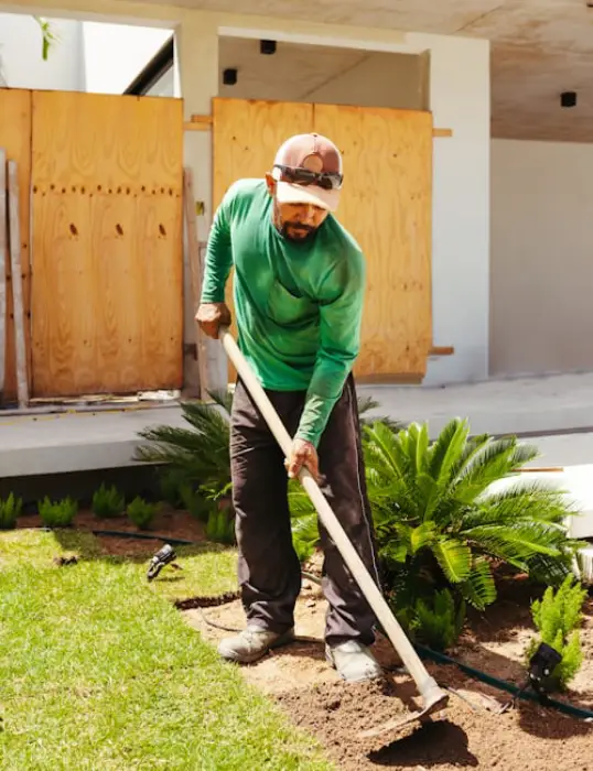 Healthy green lawn after professional garden maintenance, man working images